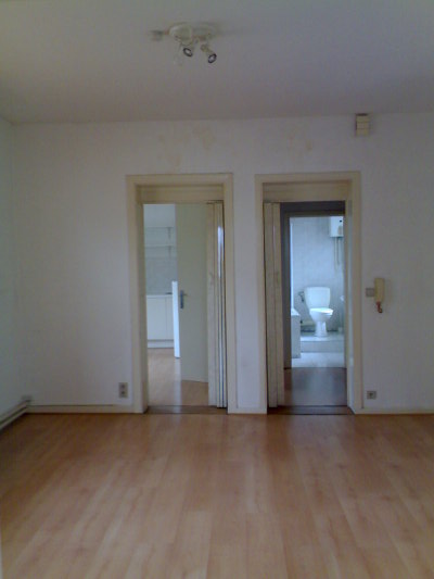 The kitchen, entrance and bathroom from the living area