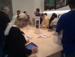People checking Facebook at the Apple Store