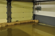 More make-shift sandbags made from boxes of marketing material, successfully holding back water from the street